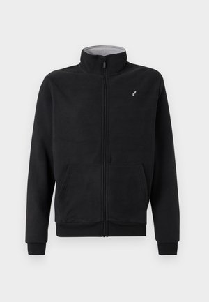 Μαύρο φλις μπουφάν με φερμουάρ, υψηλό γιακά, πλαϊνές τσέπες, ριμπ μανσέτες και διακριτική λογότυπη λεπτομέρεια στο στήθος. Μαλακή υφή.