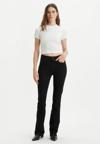 725® HIGH RISE BOOTCUT - Bootcut jeans - mottled black