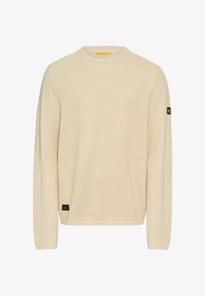 Lichtbeige gebreide trui met lange mouwen, ronde hals, gestructureerde stof en een klein zwart logo-opdruk op de linkermouw.