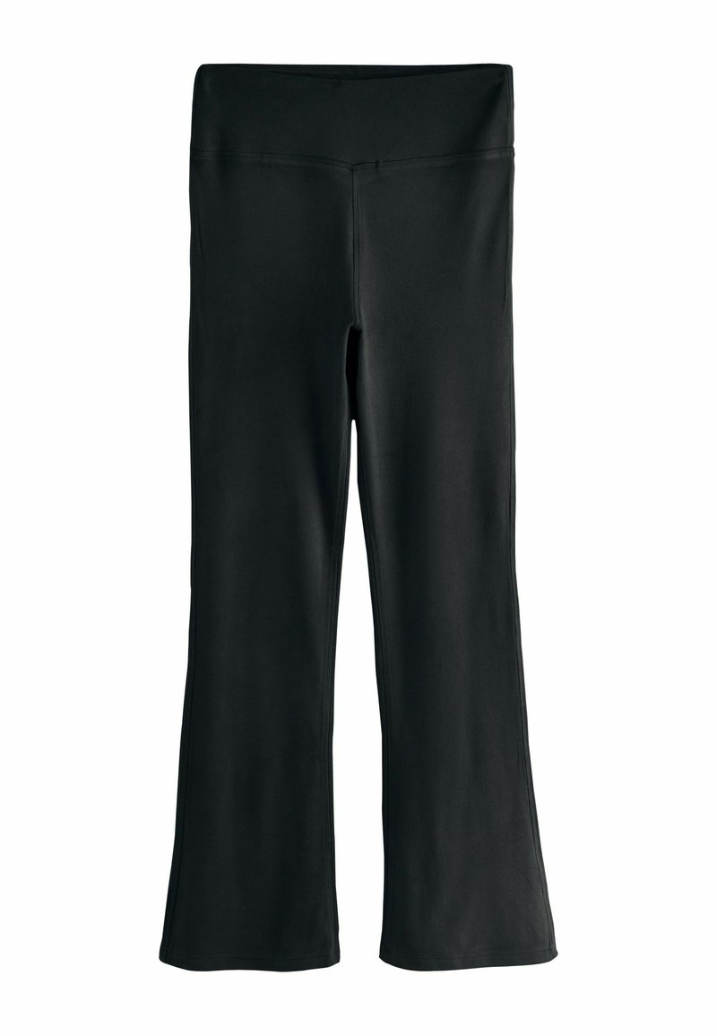 Pantalones de yoga negros acampanados hechos de un material elástico. Presentan una cintura alta y una textura suave sin patrones o acentos visibles.