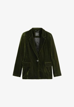 Tumši zaļš samta žakets ar ielieto apkakli, vienu pogu un divām priekšējām kabatām. Mīksta tekstūra un strukturēta forma.