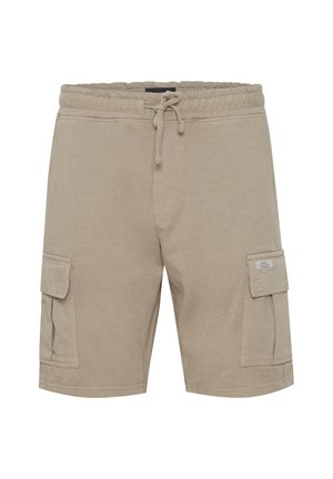 Beige cotton cargo shorts with an elastic waistband, drawstring, and two side pockets. Features stitched detailing and a pocket on the thigh.