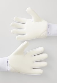 White, textured goalkeeper gloves with a snug fit, featuring finger separations and a reinforced wrist area for support.