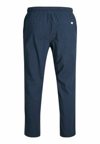 Navyblauwe broek met een elastische tailleband, taps toelopend ontwerp en een enkele achterzak. Gemaakt van zachte stof met een gladde textuur.
