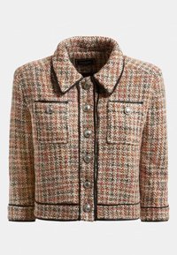 Tweed-takki lämpimissä sävyissä, jossa on kauluksellinen pääntie, kaksi etutaskua, hopeanväriset napit ja musta reunus reunojen ympärillä.