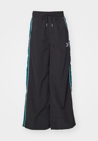 Black wide-leg pants featuring a drawstring waistband, teal side panels, and white accent stripes. Made from a smooth, lightweight material.