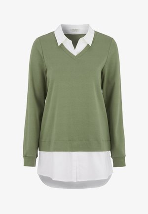 Olivgrön långärmad topp med V-ringning och vit krage. Mjukt tyg, rakt snitt och sömnadsdetaljer vid ärmsluten och nederkant.