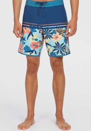Pantaloncini da bagno da uomo caratterizzati da un motivo floreale blu e azzurro, una vita rigida e una chiusura con cordoncino. Decorati con fiori multicolori.