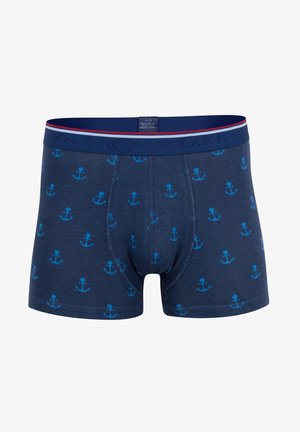 Shorts de boxeur bleu marine présentant un motif d'ancre répétitif en bleu clair. Mélange de coton doux avec une taille et des coutures contrastantes.