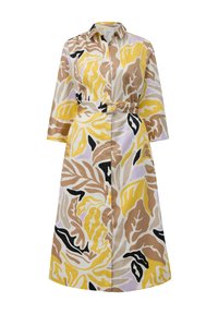 Robe longue à col, ceinturée à la taille, avec des motifs de feuilles colorés en jaune, marron et noir sur un tissu clair.