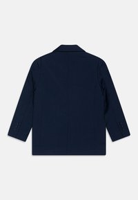 Granatowa marynarka wełniana z domieszką, z klapami, długimi rękawami i zapięciem na trzy guziki przy mankietach. Gładka tekstura, minimalistyczny design.