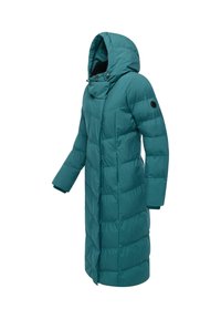 Tirkīza pūkainā jaka ar kapuci, ar pogu aizdari, quilted tekstūru un sānu kabatām. Regulējamas auklas apkaklē.