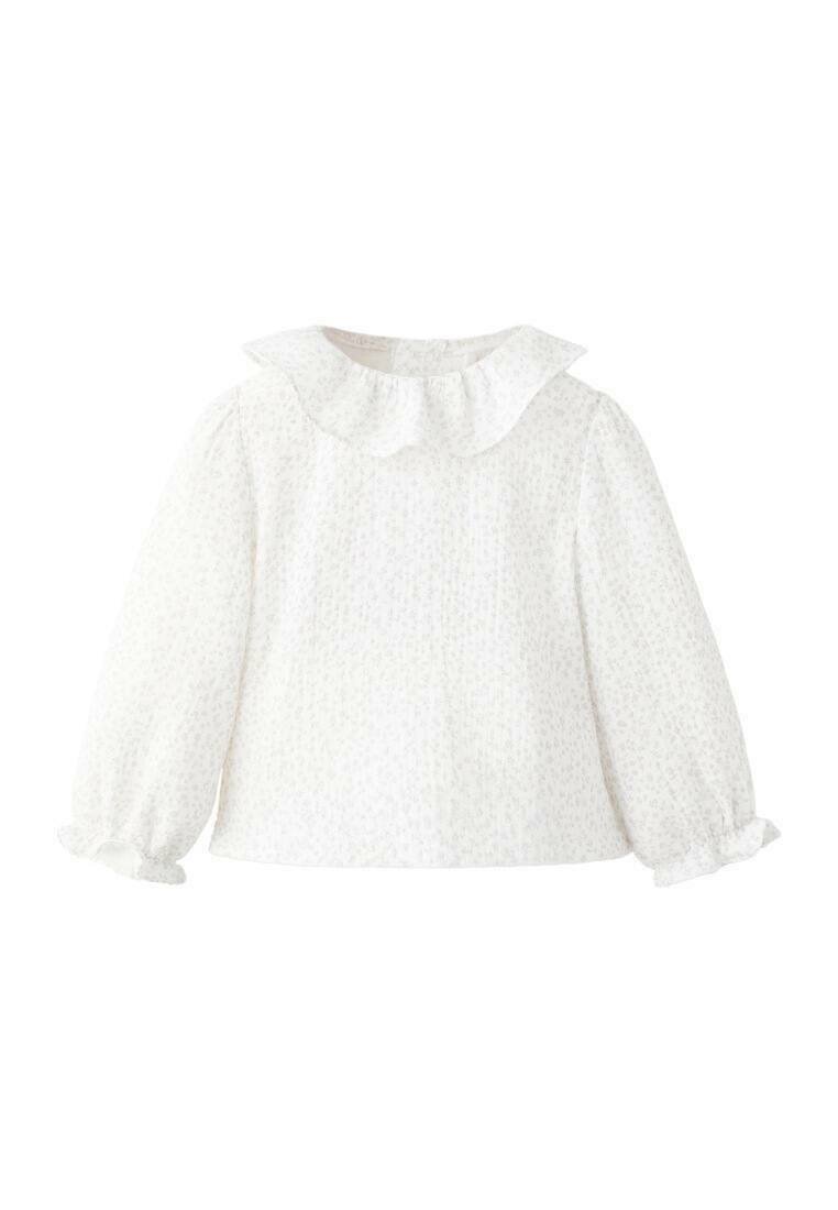 Witte blouse met lange mouwen, een gerimpelde kraag, textuurstof en gerimpelde manchetten. Subtiel bloemenpatroon overal.