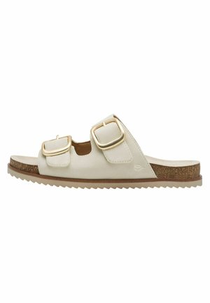 Sandale beige à glissière avec deux boucles dorées réglables, semelle en liège et semelle texturée pour une utilisation décontractée.