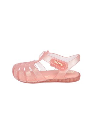 Sandalia para niño pequeño rosa translúcida con purpurina, múltiples tiras y cierre de velcro ajustable en el tobillo, con la marca "Zaxy" en el lateral.