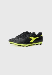 Black football shoes with yellow accents, featuring a smooth leather upper, textured design, and rubber studs for traction.