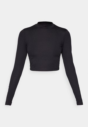 Zwarte lange mouwen crop top met een hoge hals. Gemaakt van ribbelstof, met aansluitende mouwen en een nette, naadloze zoomafwerking.
