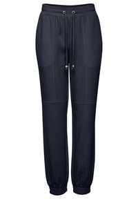 Navy sweatpants med dragsko i midjan, sidofickor och ribbade ankelslut. Mjuk tyg med en slät textur och inga synliga mönster.