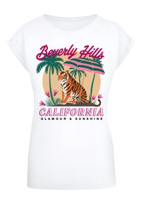White short-sleeve T-shirt featuring a graphic of a tiger, palm trees, and an umbrella, with "Beverly Hills California" text in pink and black.
