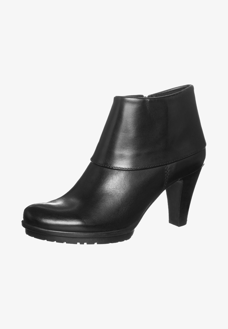 Botte courte en cuir noir avec une silhouette effilée, un bout arrondi et un talon haut. Présente une texture lisse et un design minimaliste.
