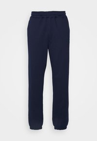 Pantalones de chándal navy hechos de suave algodón, con cintura y puños elásticos, de corte relajado y sin patrones visibles ni detalles de herrajes.