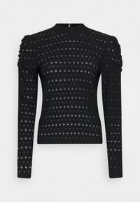 Svart långärmad topp med texturerad design som har cirkulära mönster, samlade axlar och en figurnära silhuett. Dragkedja i ryggen.