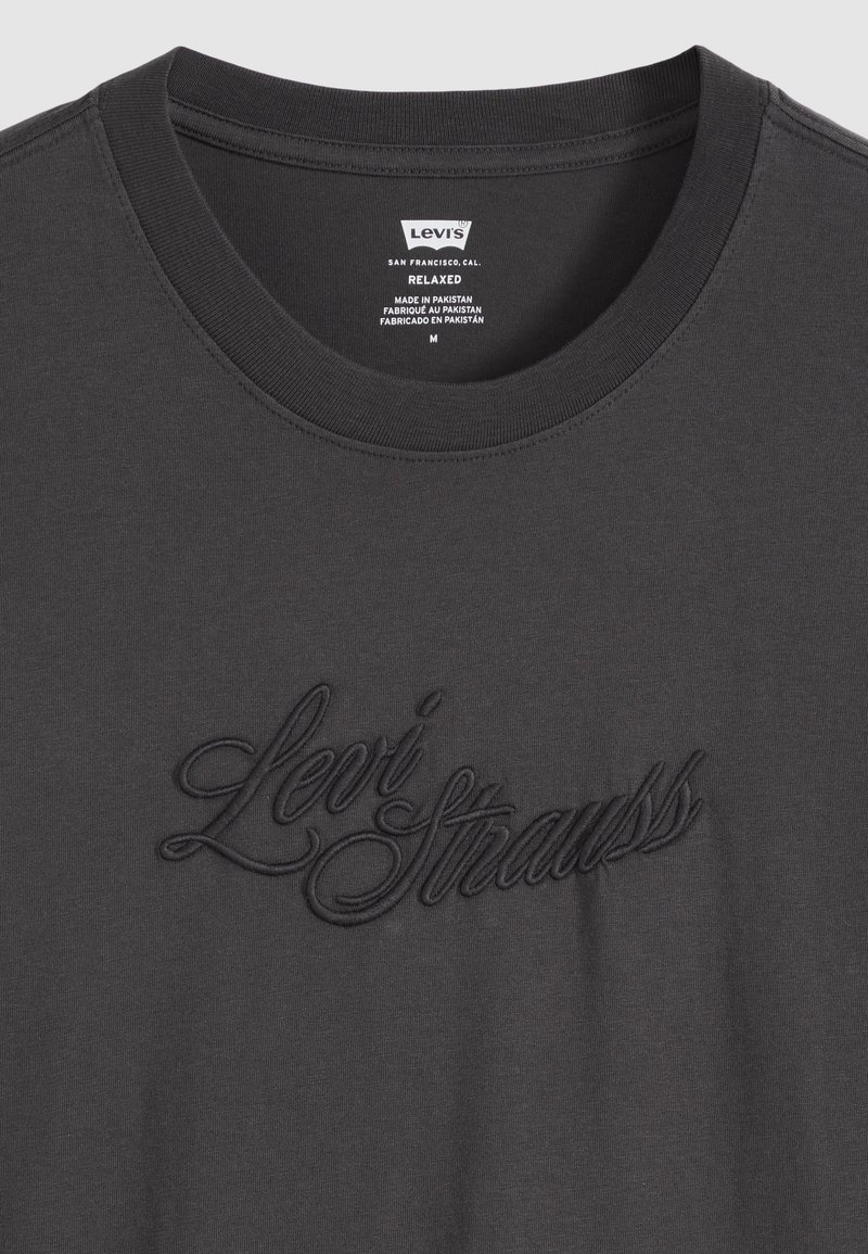Dark gray Levi's relaxed fit t-shirt with embossed Levi Strauss script logo on front and printed size and origin label inside collar.