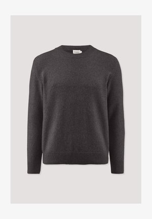 Kolenka kleurige gebreide trui met lange mouwen en een ronde halslijn. Kenmerkend zijn de geribbelde manchetten en zoom, gemaakt van een zachte, gestructureerde stof.