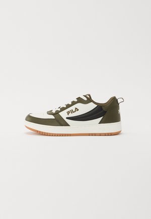 Green and white leather sneaker with black accents, round toe, padded collar, white laces, and gum rubber sole. Features Fila logo.