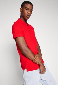 Tommy Jeans PLACKET - Polo - deep crimson