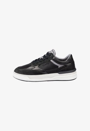 Black leather and suede sneakers with gray accents, cushioned collar, round toe, and white rubber sole featuring textured tread pattern.
