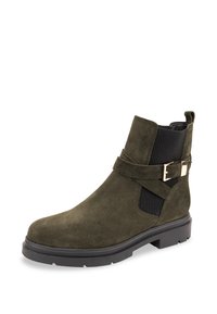 Olive green suede ankle boot with elastic side panels, buckle accent, textured upper, and a flat black rubber sole.