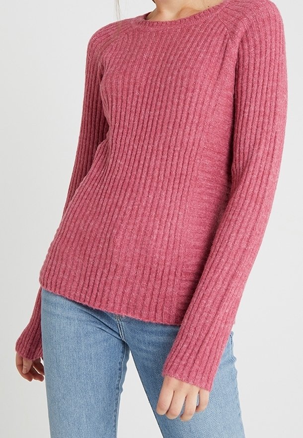 Ribbed, long-sleeve sweater in light pink. Made of soft fabric with a round neckline and a relaxed fit, featuring textured detailing throughout.
