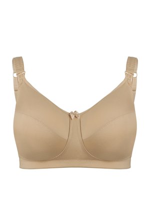 Beżowy biustonosz o gładkiej fakturze, z krojem w kształcie litery U, regulowanymi ramiączkami i małą kokardką na środku. Bez wkładek i fiszbin.