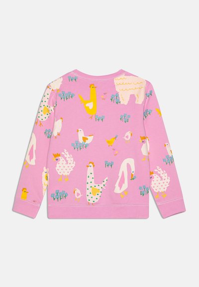 Roosa pusak pikaevarustega, millel on värvilised, koomilised taluloomad ja taimed erinevates mustrites kogu kangal.