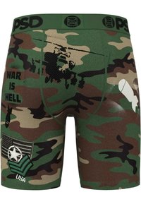 Boxers ajustados de camuflaje en verde, marrón y beige. Presentan impresiones gráficas de un helicóptero, el texto "LA GUERRA ES UN INFIERNO" y parches de estilo militar.
