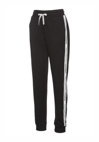 Schwarze Jogginghosen mit Kordelzug, schmal zulaufenden Beinen und seitlichen Streifen, auf denen "FRENCH CONNECTION" in weißem Text steht. Weicher Stoff.