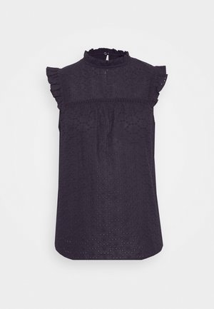 Dark navy sleeveless blouse with a high neck, ruffled shoulder trim, and textured pattern of small flowers and dots.