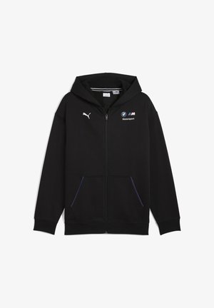 Crna zip majica od mekanog materijala. Ima kapuljaču, prednje džepove i plave akcentne detalje. Prikazuje logotipe Puma i BMW Motorsport.