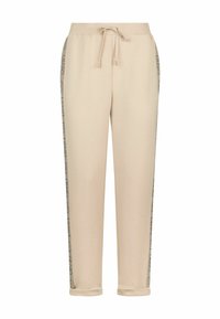 Pantalons joggers beiges avec une taille à cordon, présentant des panneaux latéraux à motifs et des ourlets resserrés, fabriqués en tissu doux et lisse.