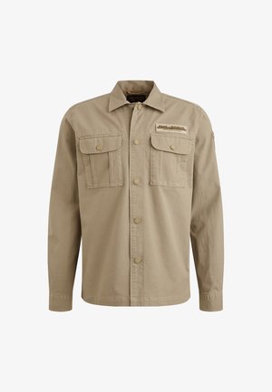 Camicia beige con bottoni, due tasche sul petto, colletto arrotondato e maniche lunghe. Presenta bottoni in ottone e una toppa ricamata del marchio.
