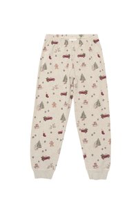 Pyjamabroek van lichtgewicht beige stof met feestelijke patronen, waaronder rode vrachtwagens, bomen, cadeaus, peperkoekenmannen en ornamenten. Met elastische tailleband.