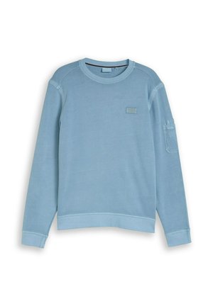 Lichtblauwe sweatshirt met lange mouwen en ronde hals, voorzien van een klein embleem op de borst en een nuttige zak op de bovenkant van de linkermouw.