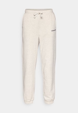 Ανοιχτό μπεζ παντελόνι φόρμας από μαλακό ύφασμα, με ελαστική μέση και κορδόνι, καθώς και μανσέτες στα πόδια. Εκτυπωμένο το λογότυπο "BJÖRN BORG".