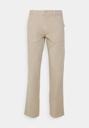 Beesidised puuvillased püksid sirge jala kujundusega, kus on kaks esi-taskut ja kontrastne õmblus allääres.