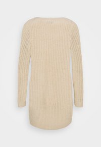 Lungo maglione lavorato a maglia beige chiaro con vestibilità comoda, polsini a coste e un motivo a maglia aperta. Collo rotondo semplice e lunghezza media.