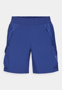 Pantaloni sportivi blu realizzati in tessuto leggero, dotati di vita elastica e due tasche laterali con dettagli in bottone.
