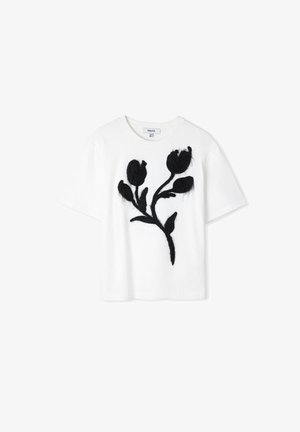 Witte katoenen t-shirt met een zwart bloemenborduursel. Het shirt heeft korte mouwen en een ontspannen pasvorm.