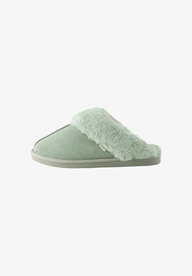 Green suede slipper with a fluffy, faux fur collar. Features a rounded toe, flat sole, and a simple stitched accent detail.