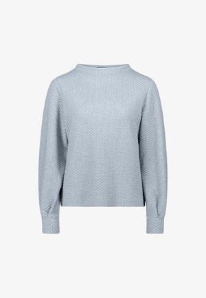 Light blue textured long-sleeve top with a high neckline and wide sleeves, featuring a subtle honeycomb pattern across the fabric.